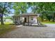 Charming home featuring a welcoming front porch, fresh landscaping, and a mix of modern and traditional design elements at 118 Globe St, Mount Holly, NC 28120