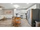 Modern open-concept kitchen featuring stainless steel appliances and a large island with seating at 118 Globe St, Mount Holly, NC 28120