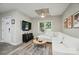 Bright living room with a white couch, and modern decor creating a welcoming atmosphere at 118 Globe St, Mount Holly, NC 28120