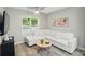 Cozy living room with a large window, comfortable white sofa, and modern decor at 118 Globe St, Mount Holly, NC 28120