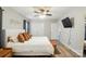 The main bedroom has a ceiling fan, modern flooring, and closet at 118 Globe St, Mount Holly, NC 28120