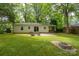 The backyard is made for entertaining with a patio and firepit at 118 Marshdale Sw Ave, Concord, NC 28025