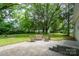 A relaxing backyard with a stone patio and green space at 118 Marshdale Sw Ave, Concord, NC 28025