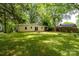 A well-maintained backyard featuring a patio and a firepit at 118 Marshdale Sw Ave, Concord, NC 28025