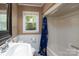 Bathroom features natural light, large mirror, and shower/bath at 118 Marshdale Sw Ave, Concord, NC 28025
