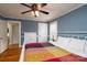 Comfortable bedroom featuring hardwood floors, large bed, and natural light at 118 Marshdale Sw Ave, Concord, NC 28025