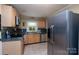 Functional kitchen with stainless steel appliances, ample counter space, and natural light, ready for culinary endeavors at 118 Marshdale Sw Ave, Concord, NC 28025