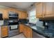 Efficient kitchen features stainless steel appliances, ample counter space, and lots of cabinet space at 118 Marshdale Sw Ave, Concord, NC 28025