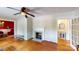Inviting living room with hardwood floors, fireplace, and decorative accents, offering a warm and comfortable atmosphere at 118 Marshdale Sw Ave, Concord, NC 28025