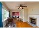 Open-concept living room showcasing hardwood floors, natural light, and a cozy fireplace at 118 Marshdale Sw Ave, Concord, NC 28025