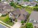 An aerial view shows the home has a well-manicured yard, mature trees and an ample driveway at 1190 Arges River Dr, Fort Mill, SC 29715