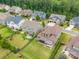 Aerial view of a neighborhood highlighting expansive backyards, mature trees, and multiple outdoor living spaces at 1190 Arges River Dr, Fort Mill, SC 29715