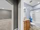 Bright bathroom features a vanity with granite counters, a shower and bathtub combination, and neutral tones at 1190 Arges River Dr, Fort Mill, SC 29715