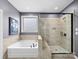Bathroom with a separate tub and walk-in shower at 1190 Arges River Dr, Fort Mill, SC 29715