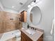 The bathroom features earth-tone tile, an oval mirror, and a granite countertop, with a walk-in shower at 1190 Arges River Dr, Fort Mill, SC 29715