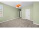 Bedroom with neutral carpet, light green walls, and windows at 1190 Arges River Dr, Fort Mill, SC 29715
