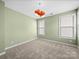 Bedroom with neutral carpet, light green walls, and windows at 1190 Arges River Dr, Fort Mill, SC 29715