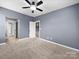 Bedroom with neutral carpet, ceiling fan, and natural light at 1190 Arges River Dr, Fort Mill, SC 29715