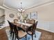 Formal dining room with a decorative chandelier, crown molding and hardwood floors at 1190 Arges River Dr, Fort Mill, SC 29715