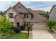 Beautiful two-story home featuring brick and stone facade, well-manicured lawn, and a two-car garage with basketball hoop at 1190 Arges River Dr, Fort Mill, SC 29715