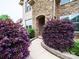 Arched stone entryway surrounded by vibrant landscaping and a walkway, leading to a welcoming entrance at 1190 Arges River Dr, Fort Mill, SC 29715