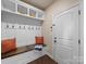 Well-organized mudroom with custom bench, storage hooks, and cabinetry, offering a practical and stylish entryway solution at 1190 Arges River Dr, Fort Mill, SC 29715