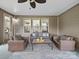 Inviting screened porch with cozy seating, providing a perfect spot for relaxation and enjoying the outdoor scenery at 1190 Arges River Dr, Fort Mill, SC 29715