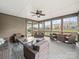 Relaxing screened porch with comfortable wicker furniture offering an outdoor retreat for dining and relaxation at 1190 Arges River Dr, Fort Mill, SC 29715