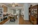 Multi-purpose space in the basement with sewing machines, storage, and display cabinets on wood-look flooring at 12125 Mountainside Ln, Charlotte, NC 28278