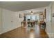 The basement features a large work and craft area with wood-look floors, storage and natural light at 12125 Mountainside Ln, Charlotte, NC 28278