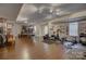 Spacious finished basement area featuring a ping pong table, workout equipment and ample storage solutions at 12125 Mountainside Ln, Charlotte, NC 28278
