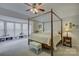 Spacious main bedroom with four poster bed, bay window, and nice furniture at 12125 Mountainside Ln, Charlotte, NC 28278