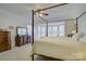 Cozy bedroom features a four-poster bed, dresser, and a bay window for lots of light at 12125 Mountainside Ln, Charlotte, NC 28278