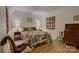 Inviting bedroom features wood-look flooring, cozy quilts and soft lighting at 12125 Mountainside Ln, Charlotte, NC 28278