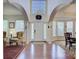 Grand foyer with soaring ceilings, hardwood floors, and elegant architectural details at 12125 Mountainside Ln, Charlotte, NC 28278