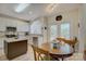 Cozy eat-in kitchen with white cabinets, stainless steel appliances, and granite countertops at 12125 Mountainside Ln, Charlotte, NC 28278