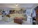 Spacious living room with comfortable seating, built-in shelves, and natural light at 12125 Mountainside Ln, Charlotte, NC 28278