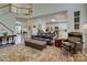 Open-concept living area seamlessly connects to the kitchen with staircase, perfect for modern living at 12125 Mountainside Ln, Charlotte, NC 28278