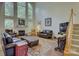 Spacious living room features a fireplace, large windows, and ample seating at 12125 Mountainside Ln, Charlotte, NC 28278