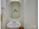 Clean powder room with a unique vessel sink, and mirror at 12125 Mountainside Ln, Charlotte, NC 28278