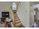 Inviting staircase with carpet steps and wooden handrail, leading to the upper level of the home at 12125 Mountainside Ln, Charlotte, NC 28278