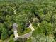 A high aerial view showcases this neighborhood with mature trees surrounding attractive homes at 12602 Angel Oak Dr, Huntersville, NC 28078
