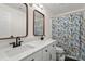 Modern bathroom with double sinks, white cabinetry, and stylish shower curtain at 12602 Angel Oak Dr, Huntersville, NC 28078