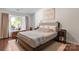 Inviting bedroom boasts natural light, hardwood floors, and neutral decor at 12602 Angel Oak Dr, Huntersville, NC 28078