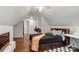 Cozy bedroom boasts natural light, hardwood floors, and neutral decor at 12602 Angel Oak Dr, Huntersville, NC 28078