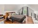 Charming bedroom with hardwood floors, sloped ceilings, and natural light at 12602 Angel Oak Dr, Huntersville, NC 28078