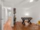 Spacious bonus room featuring hardwood floors and a foosball table at 12602 Angel Oak Dr, Huntersville, NC 28078
