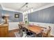Dining room with wooden table and chandelier lighting, offering a glimpse into the foyer at 12602 Angel Oak Dr, Huntersville, NC 28078