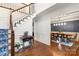 Foyer with hardwood floors, white staircase, and dining room view at 12602 Angel Oak Dr, Huntersville, NC 28078
