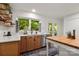 Bright kitchen featuring stainless steel appliances, butcher block island, and natural light at 12602 Angel Oak Dr, Huntersville, NC 28078